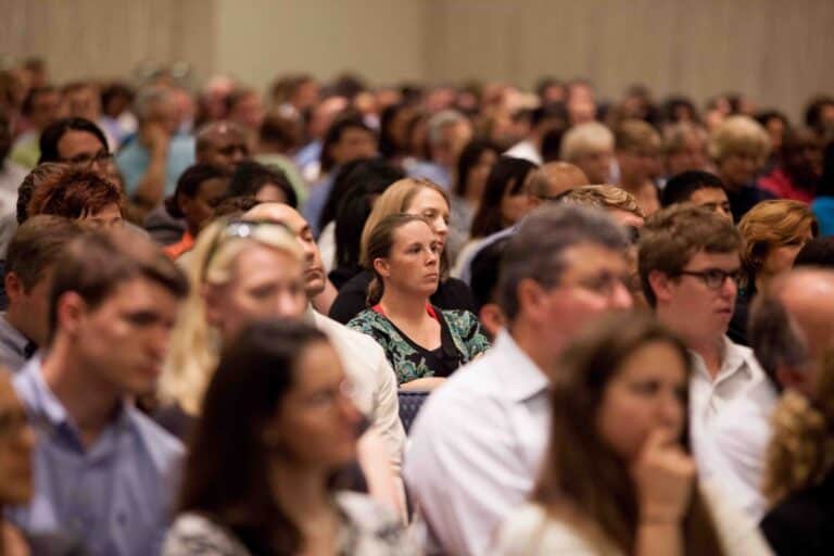 bored audience looking at the stage
