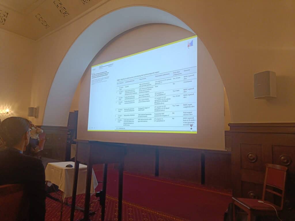 there is a presentation happening. the presenter cannot be seen as they do not appear important. there is a slide. it cannot be read becaiuse it is too complex.